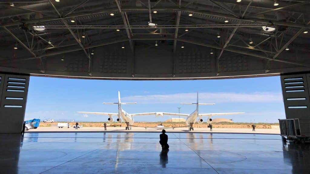 Virgin Galactic ground crew guiding the company carrier plane