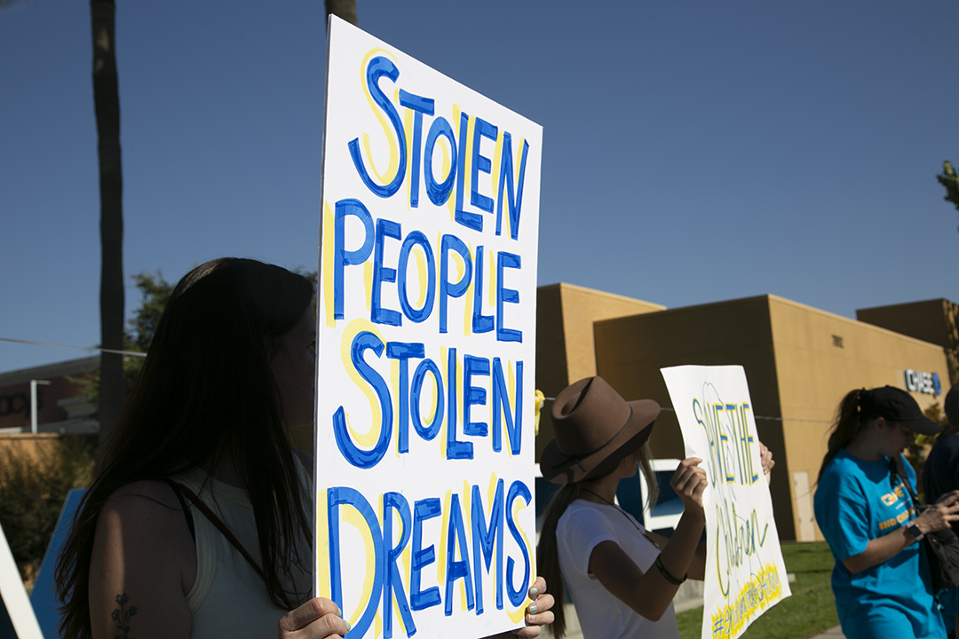 Image of people protesting child trafficking in Fresno, California