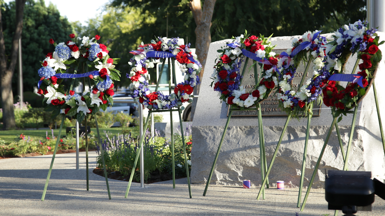 Photo of wreaths and memorial marker in Clovis, California, commemorating the 9-11 terrorist attacks