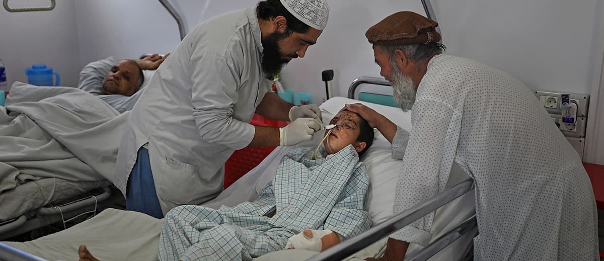 Photo of a paramedic tending to Nesser Ahmad