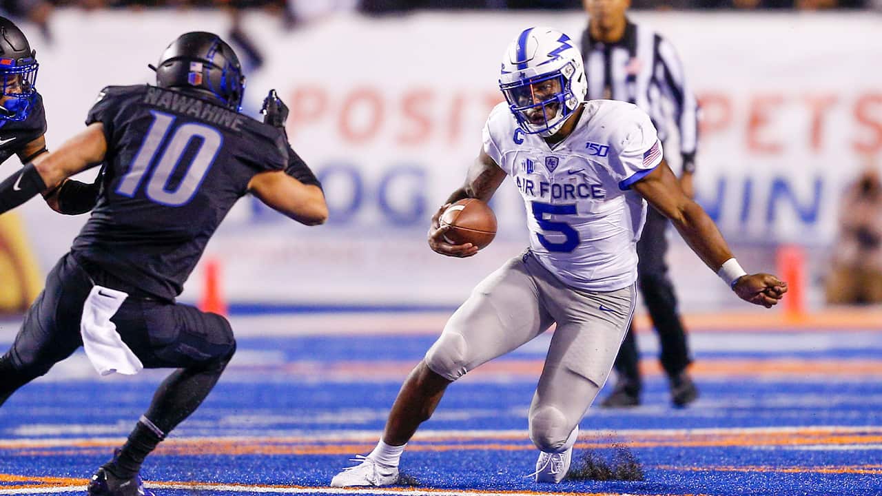 Picture of AF quarterback Donald Hammond III evading a tackler