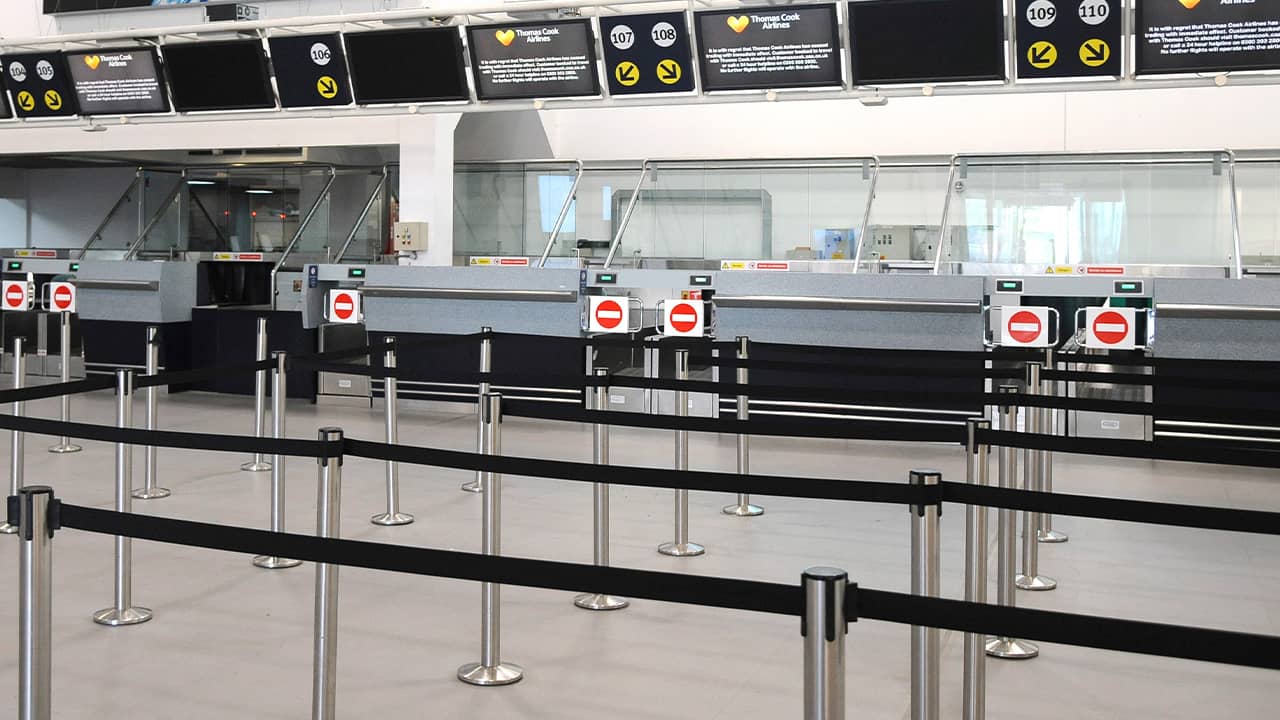 Photo of deserted Thomas Cook check-in counters 