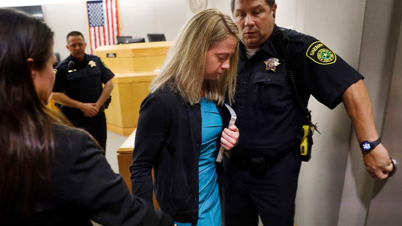 Photo of Amber Guyger leaving court for jail