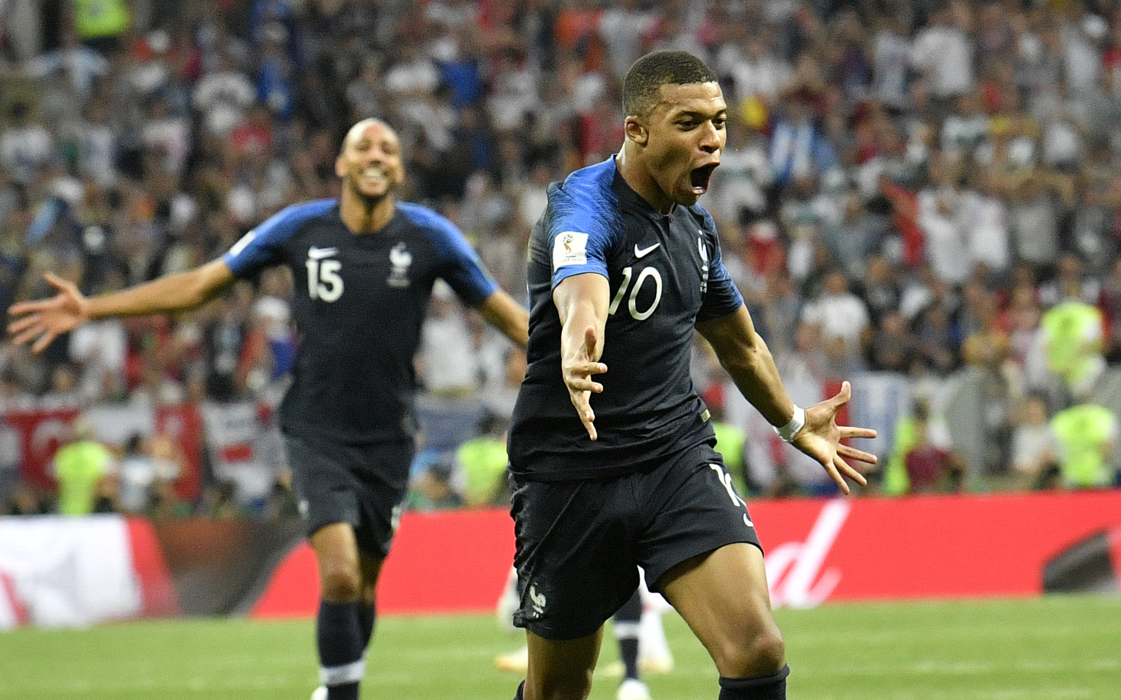 Photo of French soccer star Kylian Mbappe celebrating his goal.