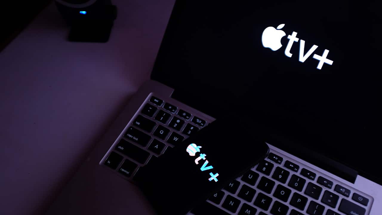Photo of Apple TV Plus on an iPhone and laptop