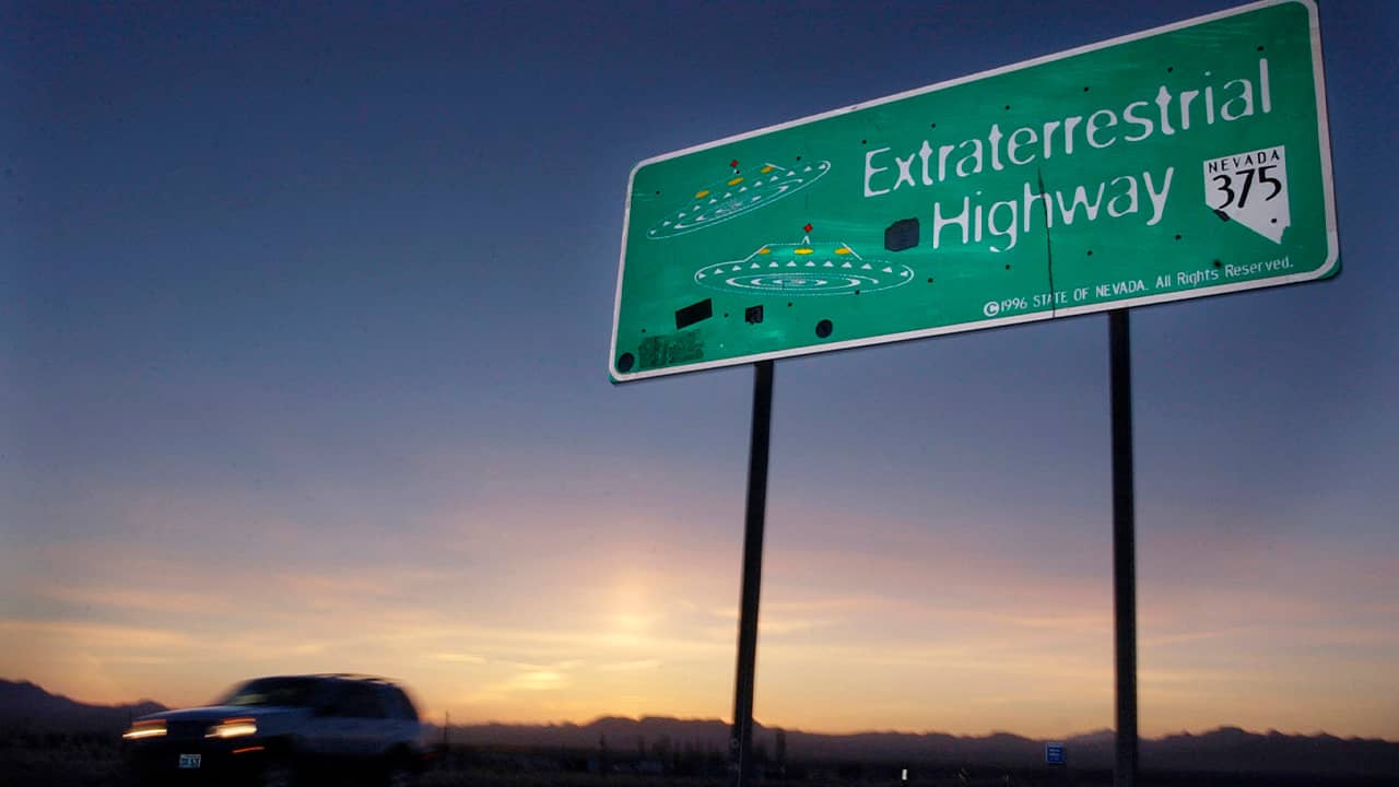 Photo of a car moving along the Extraterrestrial Highway