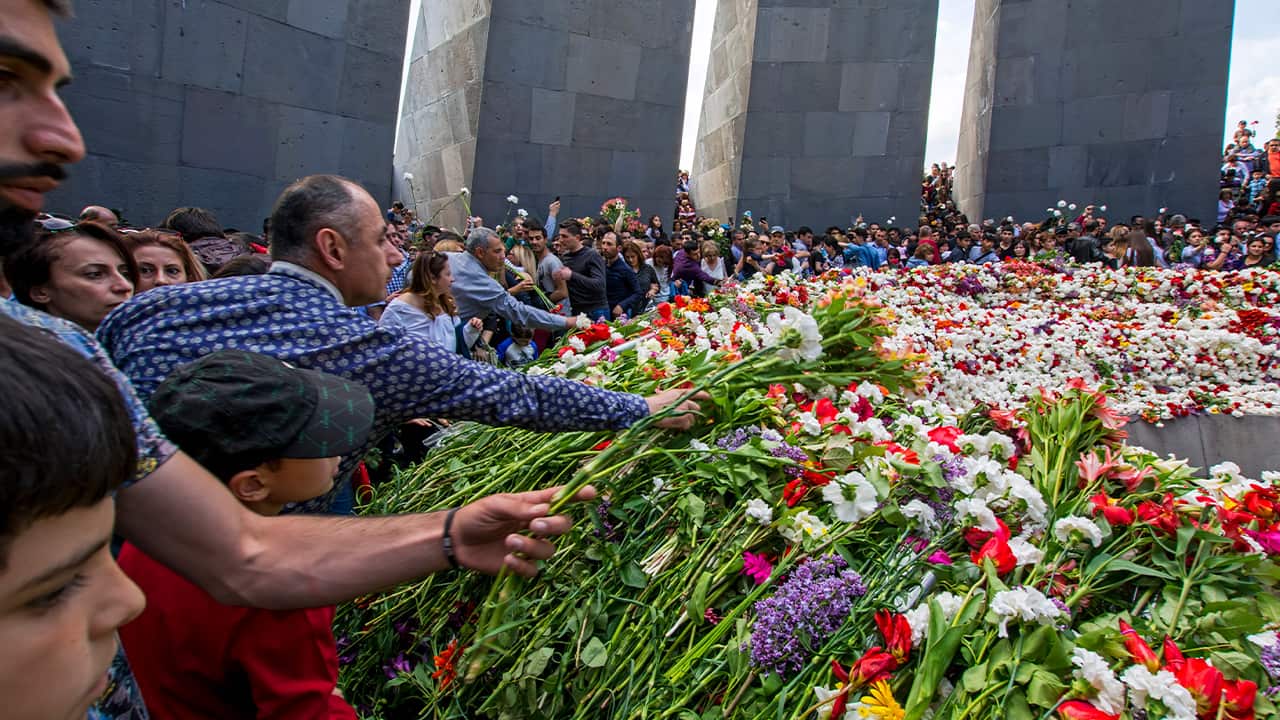 Photo of Armenians placing flowers at Armenian genocide memorial in Yerevan, Armenia