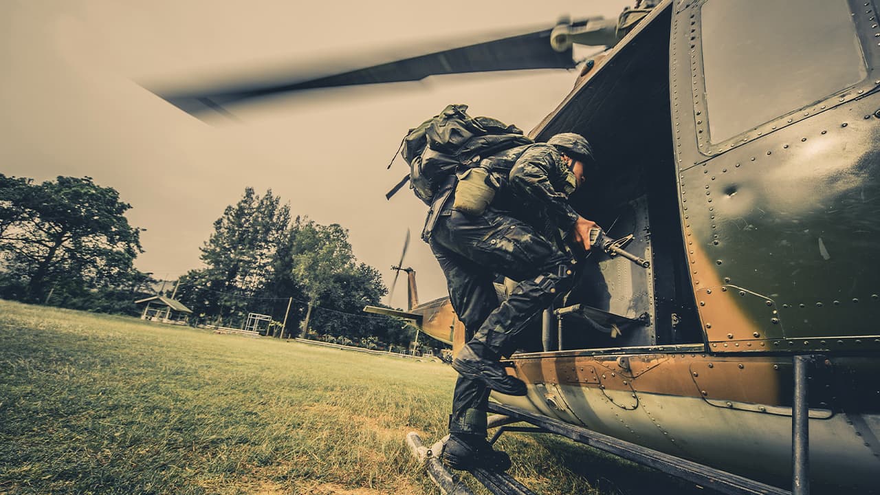 Photo of a U.S. Army soldier boarding a helicopter