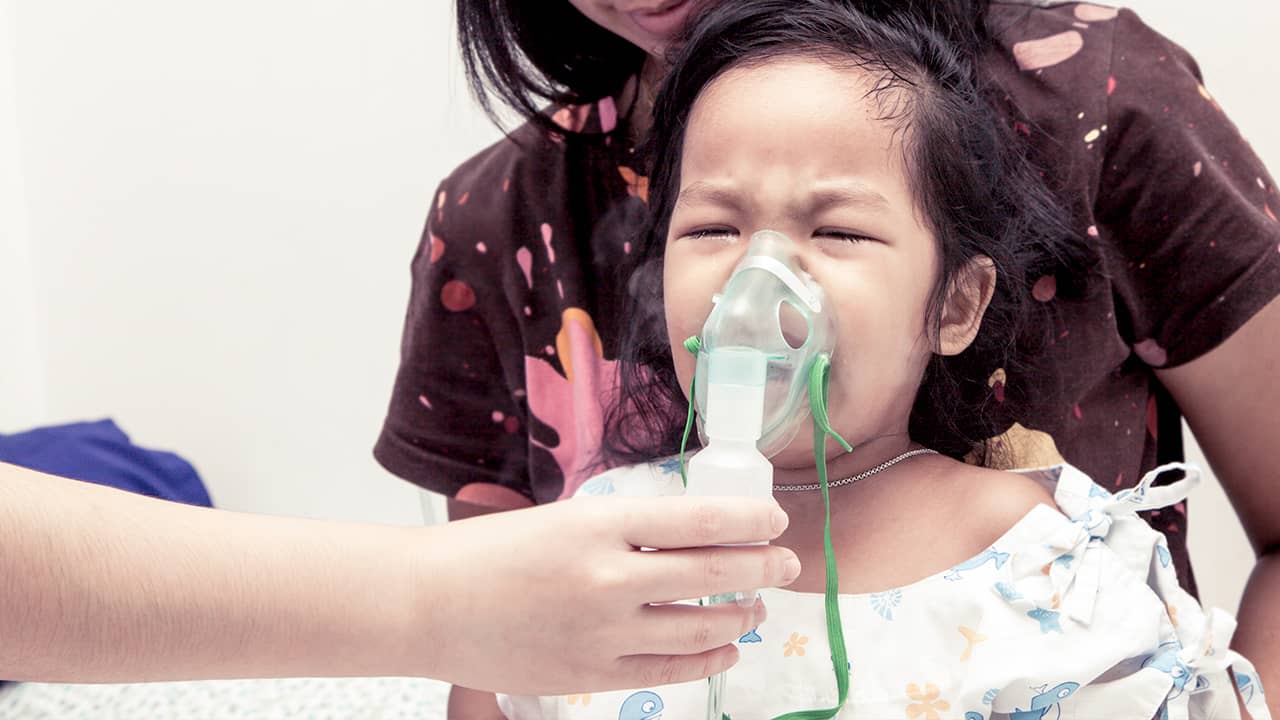 Photo of child with inhaler mask