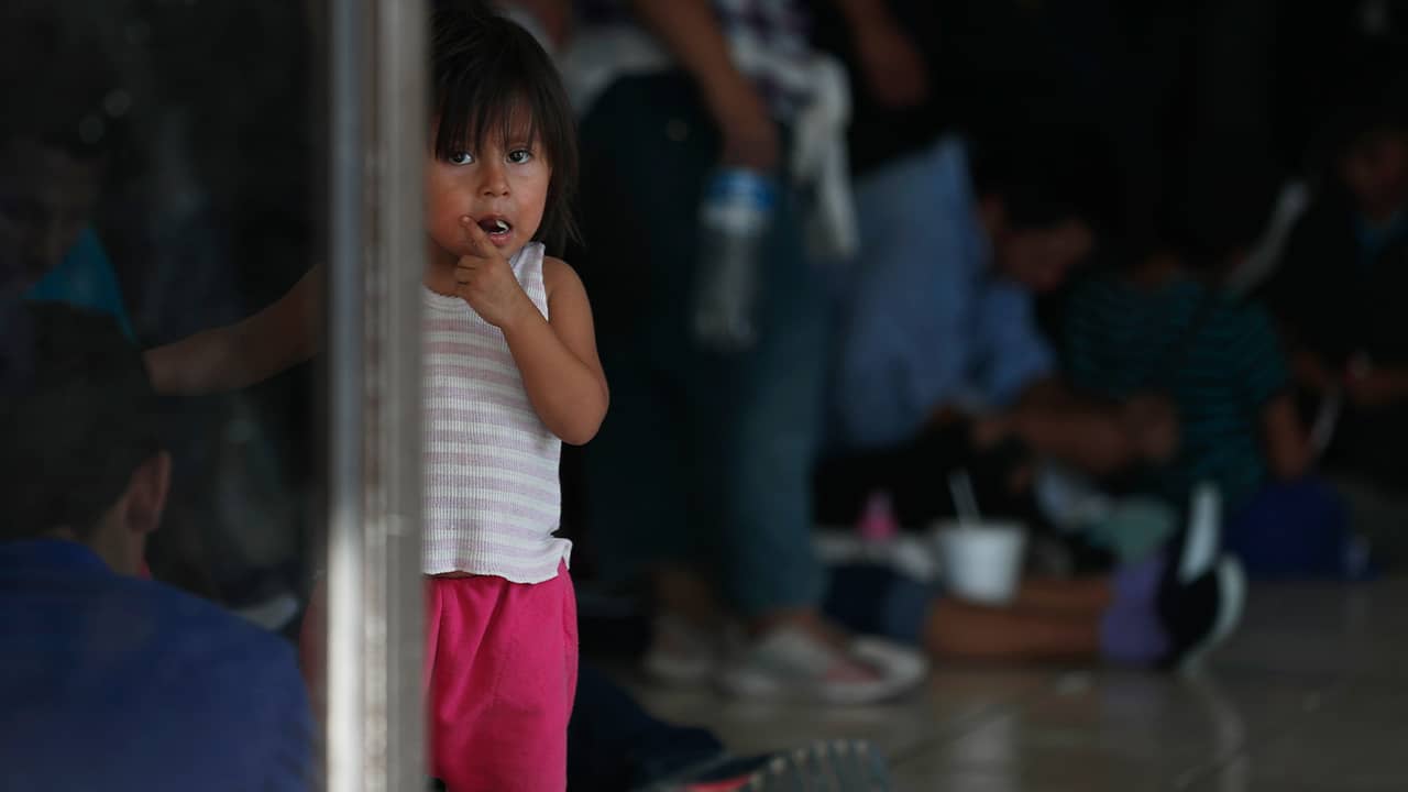 Photo of migrant child at an immigration center