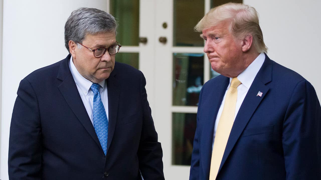 Photo of Attorney General William Barr, left, and President Donald Trump