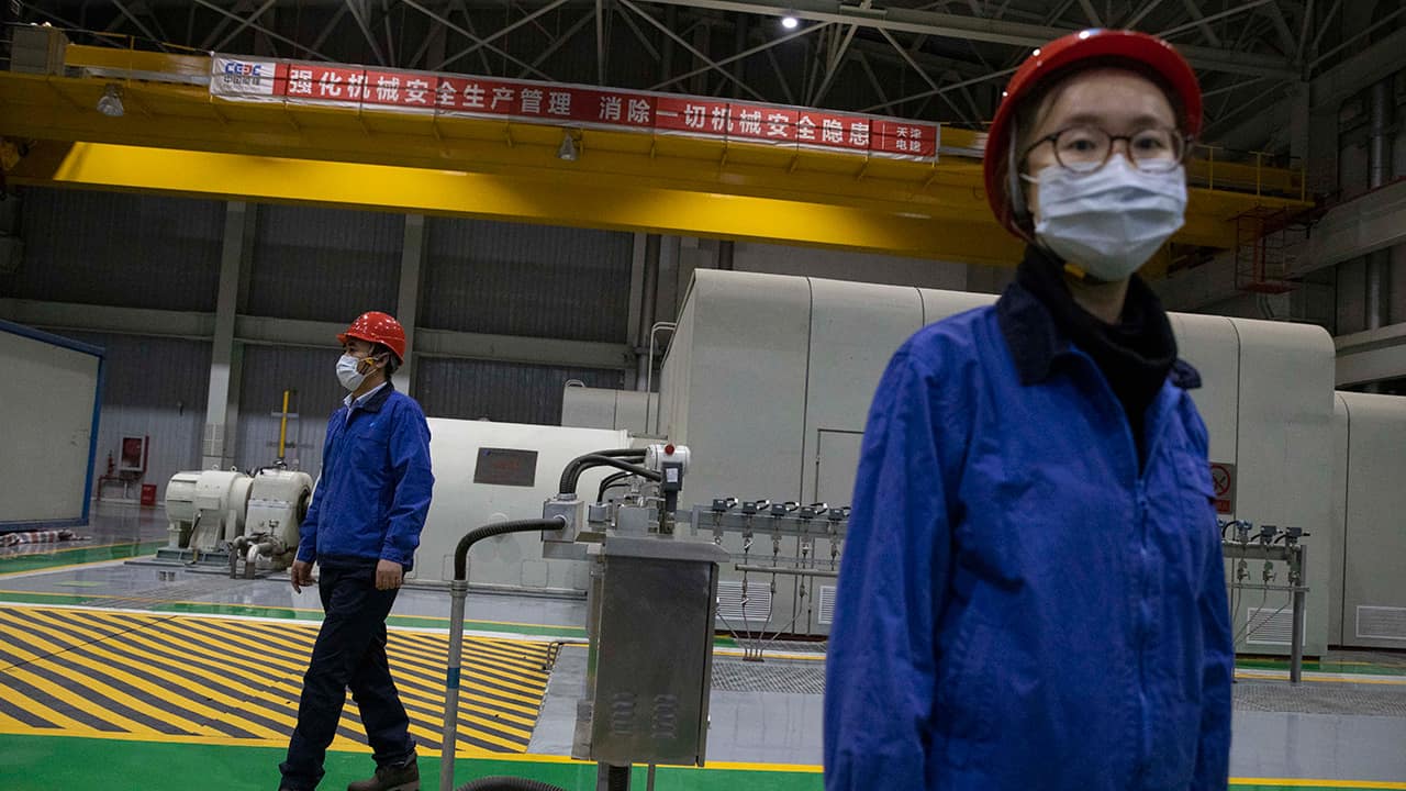 Photo of workers at a power plant in Beijing 