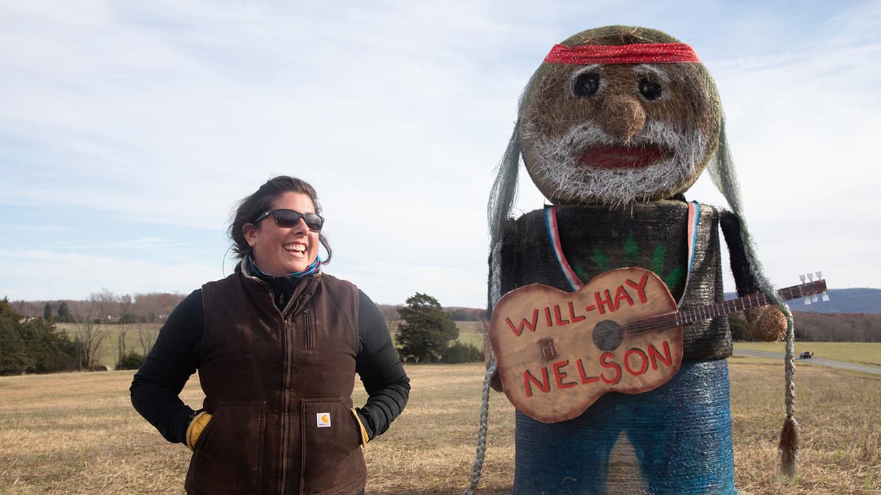 Photo of Beth Bays and her 'Will-Hay Nelson' sculpture 