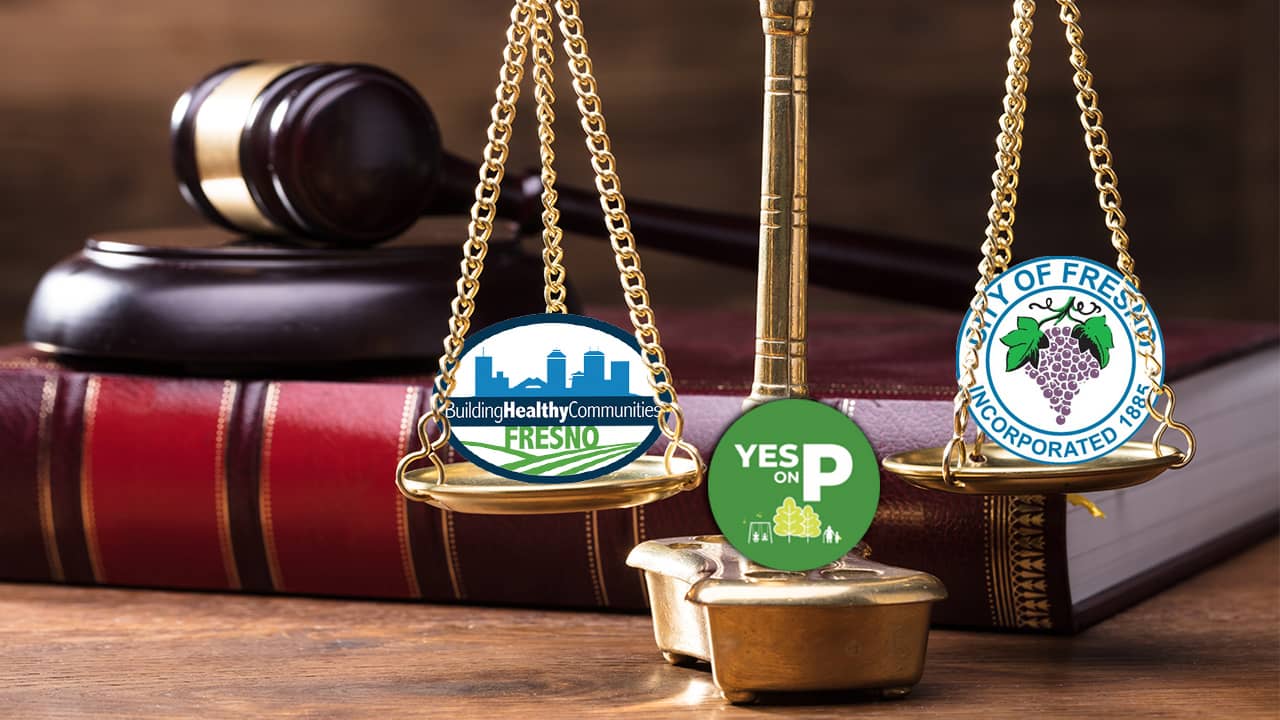 Illustration of scales of justice with city of Fresno and Measure P logos