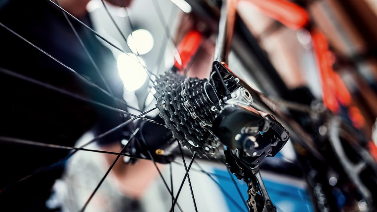 Photo of a bicycle being worked on inside a shop