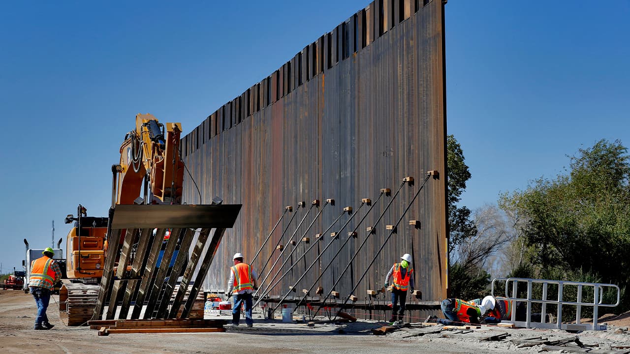 Photo of government contractors working on a section of the Pentagon-funded border wall
