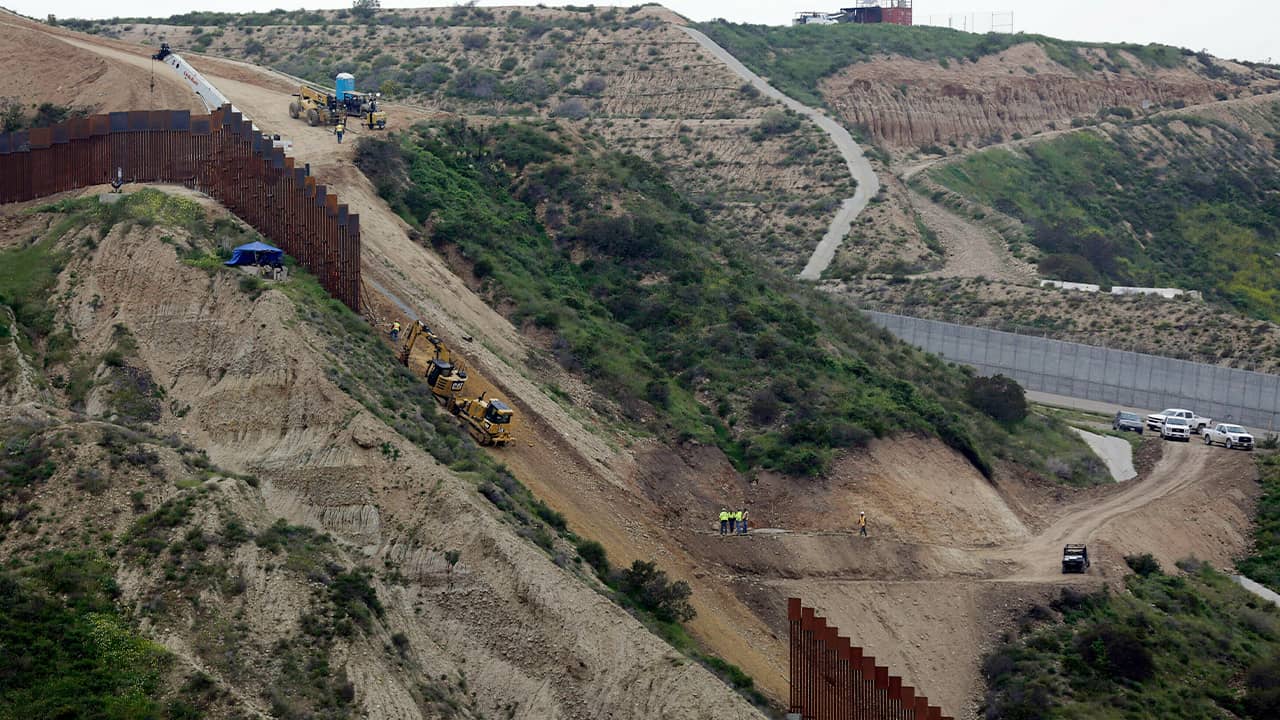 Photo of border wall construction in San Diego
