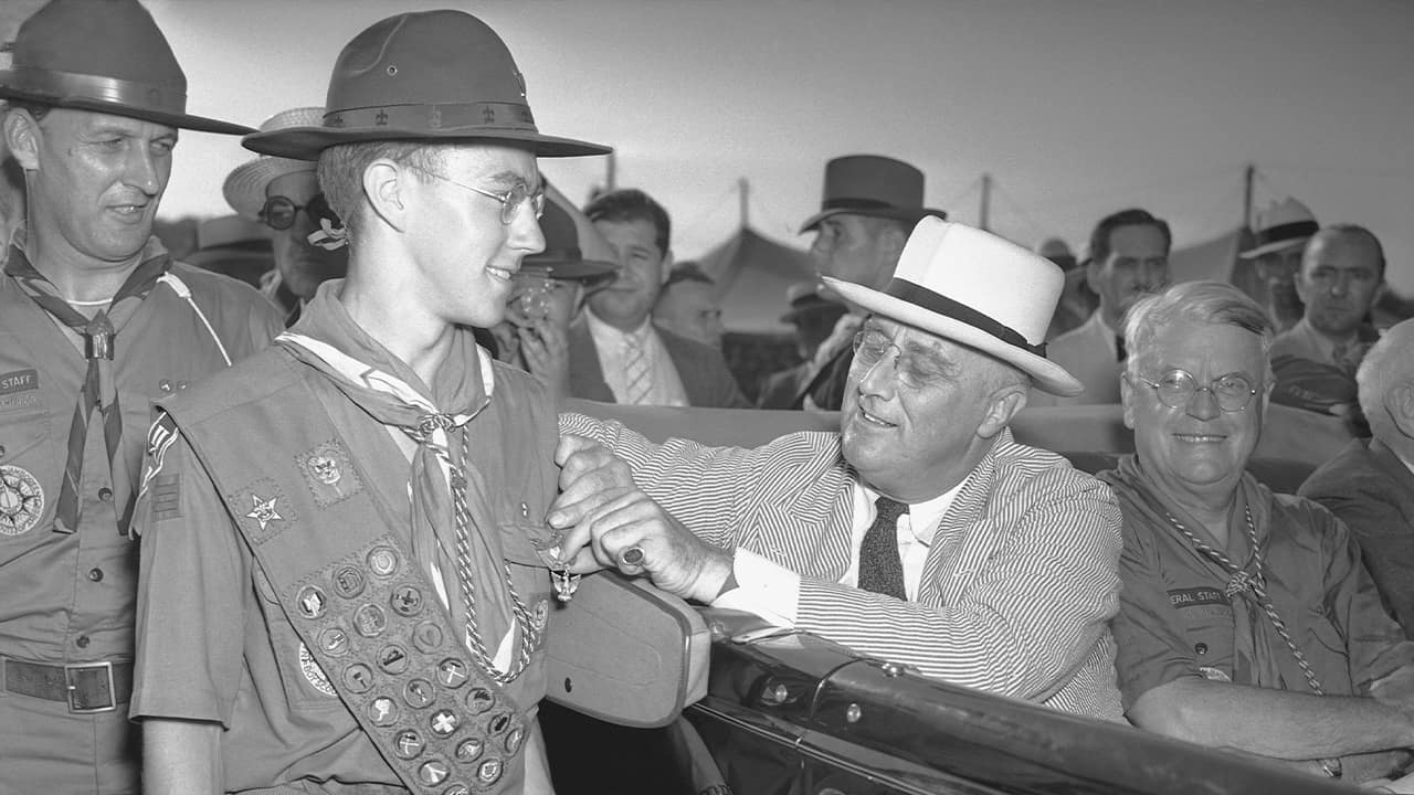 Photo of a boy scout and FDR in 1937