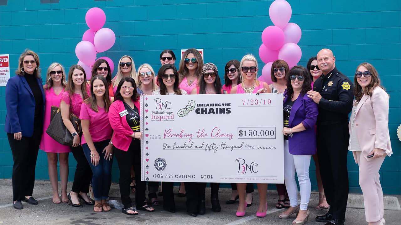 Photo of PINC donating $150,000 to Breaking the Chains
