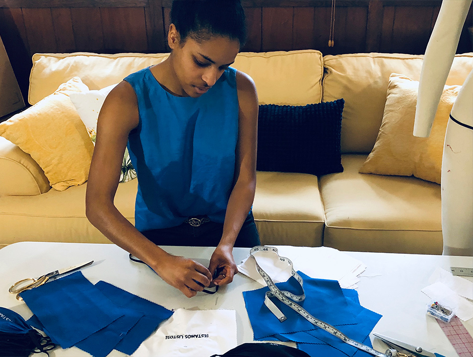 Photo of Briana Danyele sewing face masks 