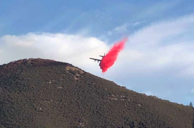 Photo of plane dropping fire retardant on the Briceburg Fire