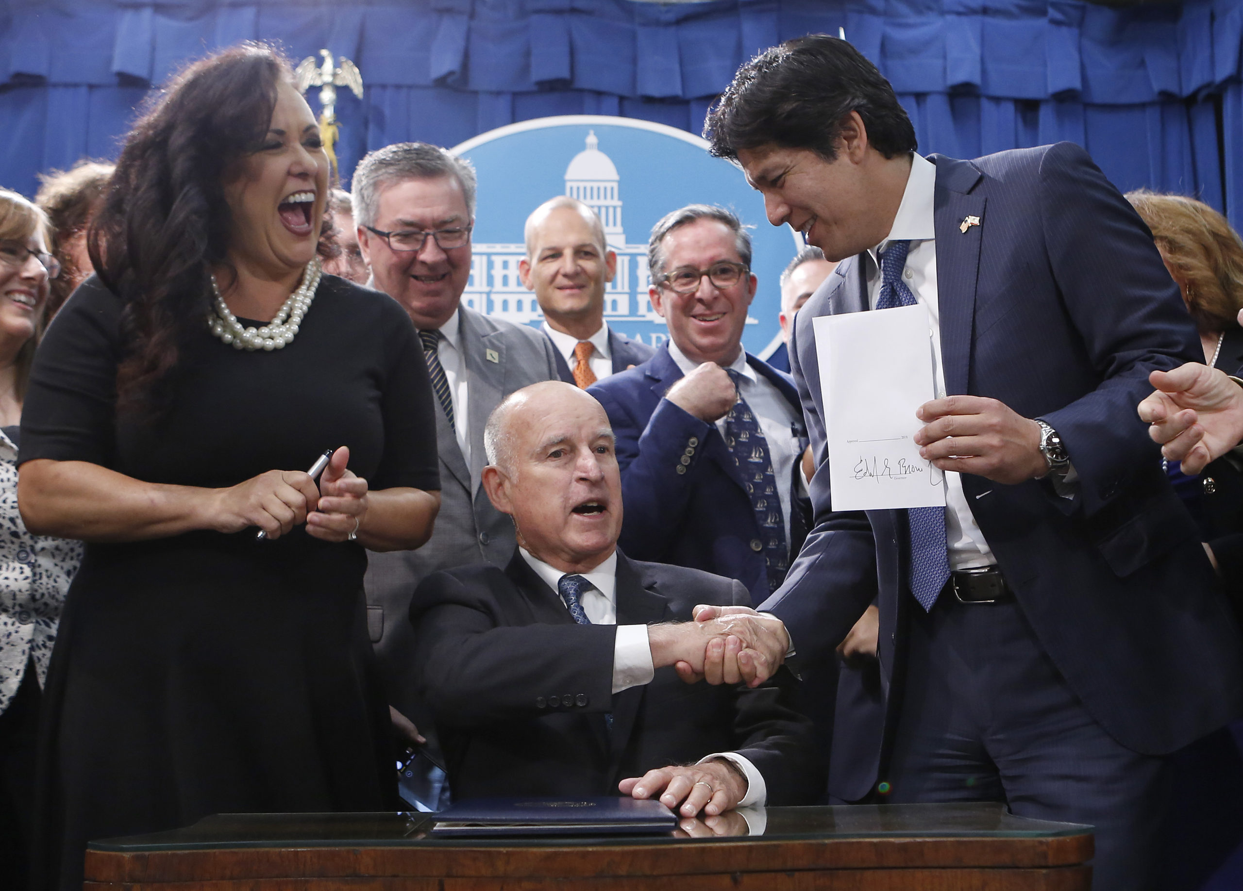 Photo of Gov. Brown signing an environmental bill