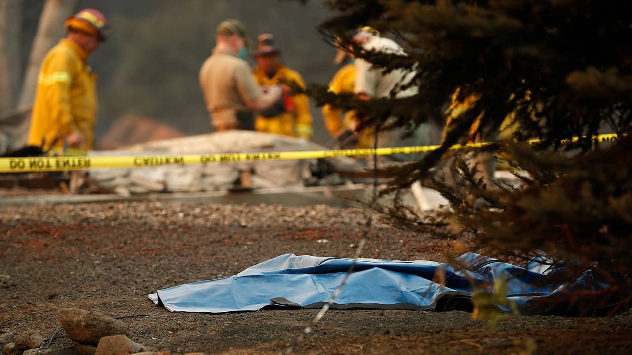 Photo of officials searching for people in Paradise, CA