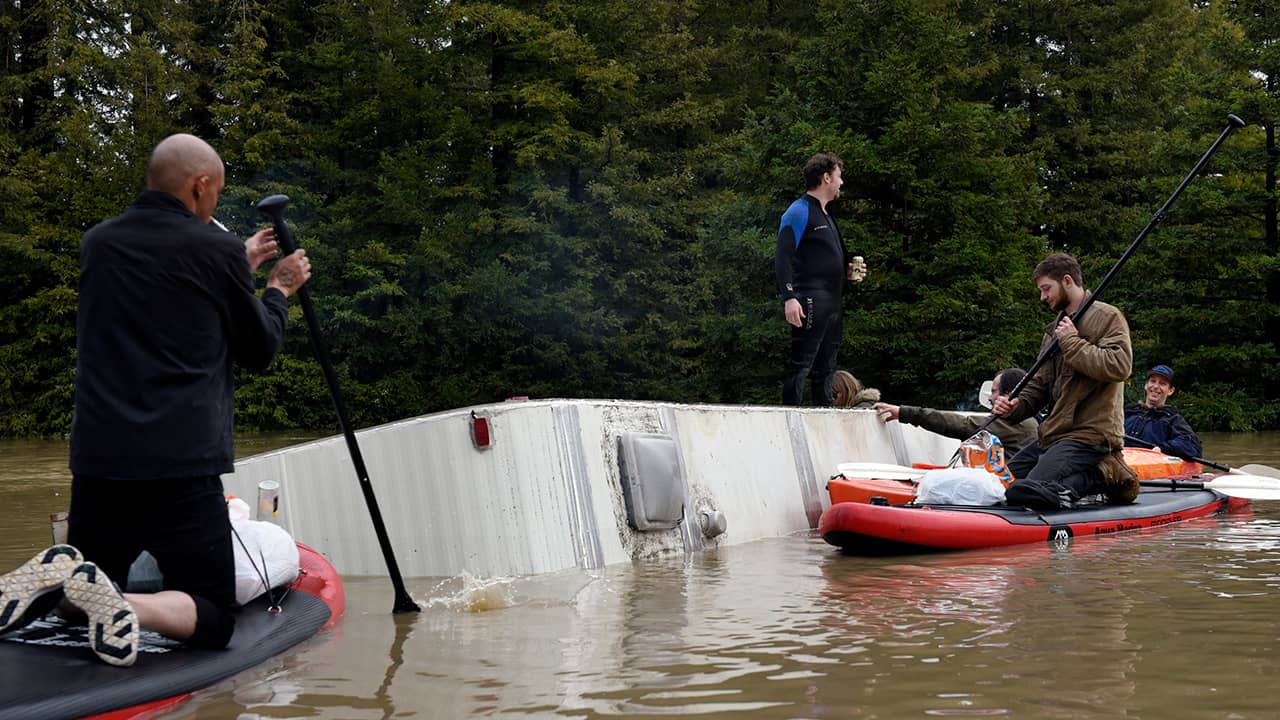 Photo of a submerged RV in the flood waters of the Russian River