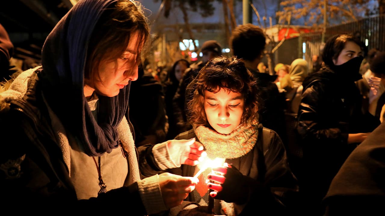 Photo of people gathering for a candlelight vigil
