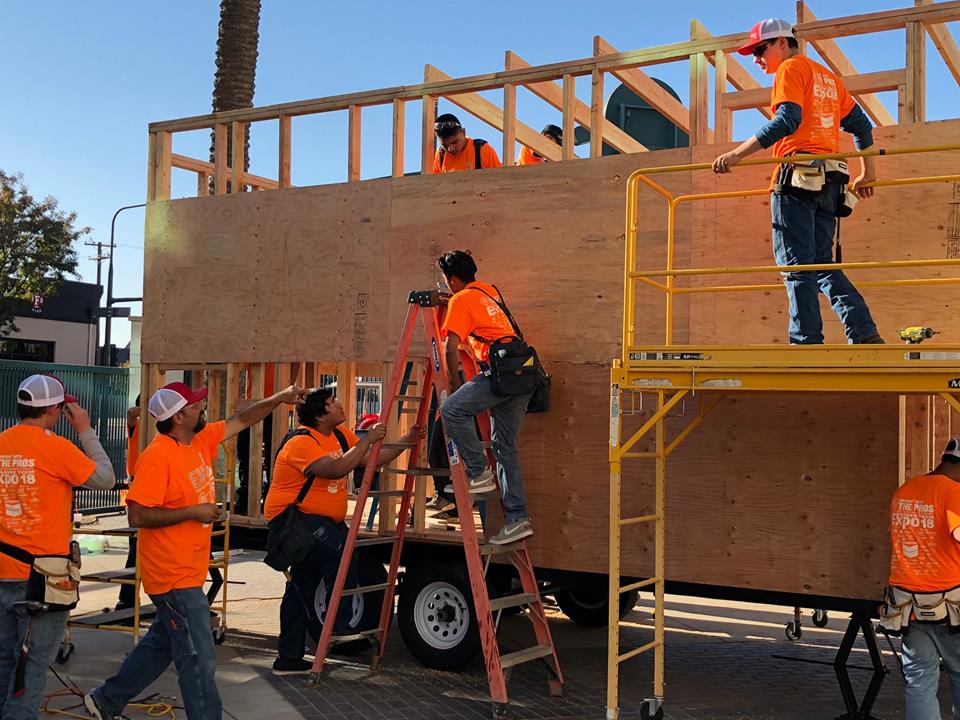 Photo of students working on a tiny house at Career Tech Expo.