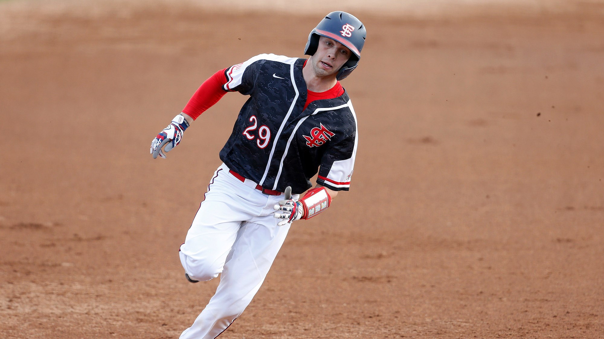 Photo of Fresno State catcher Carter Bins rounding the bases