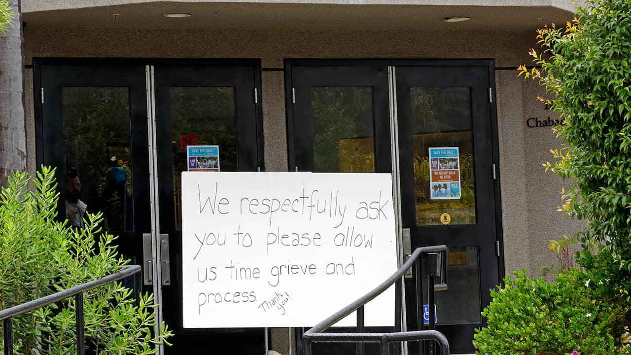 Photo of a sign outside of the Chabad of Poway synagogue 