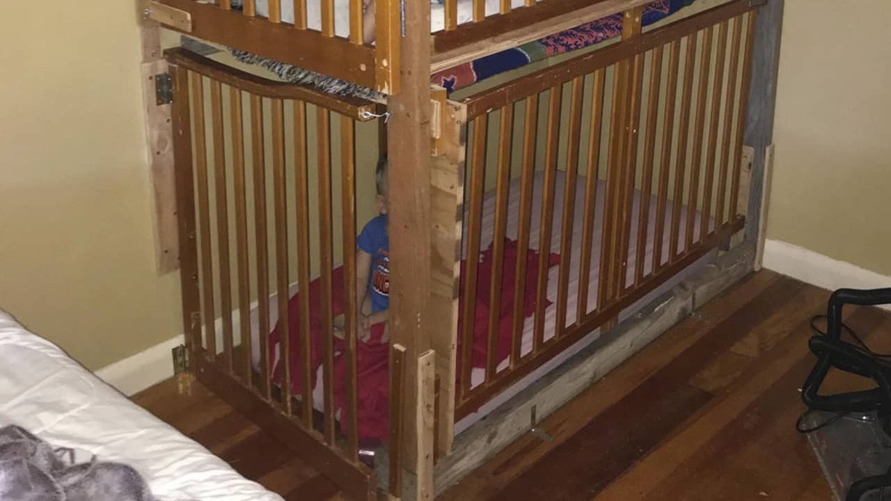 Photo of two boys in cages in a home in Tulelake, CA