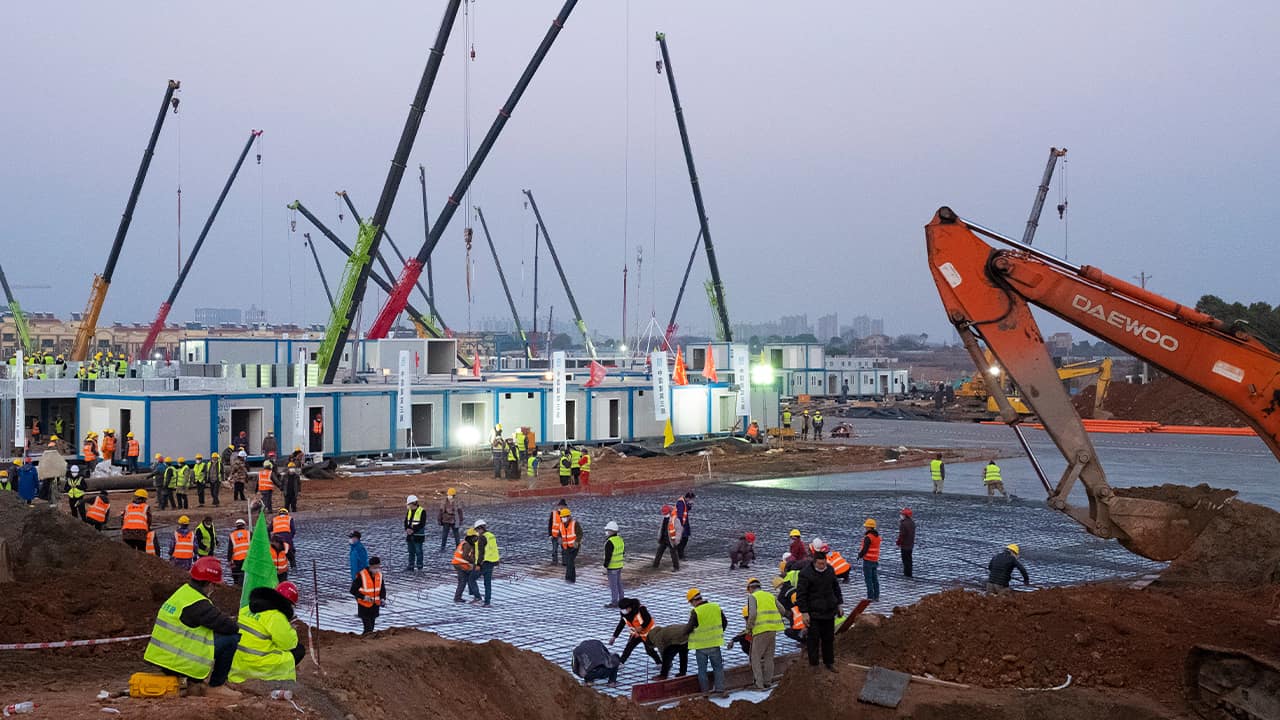 Photo of workers at the site of the Huoshenshan temporary field hospital being built in Wuhan