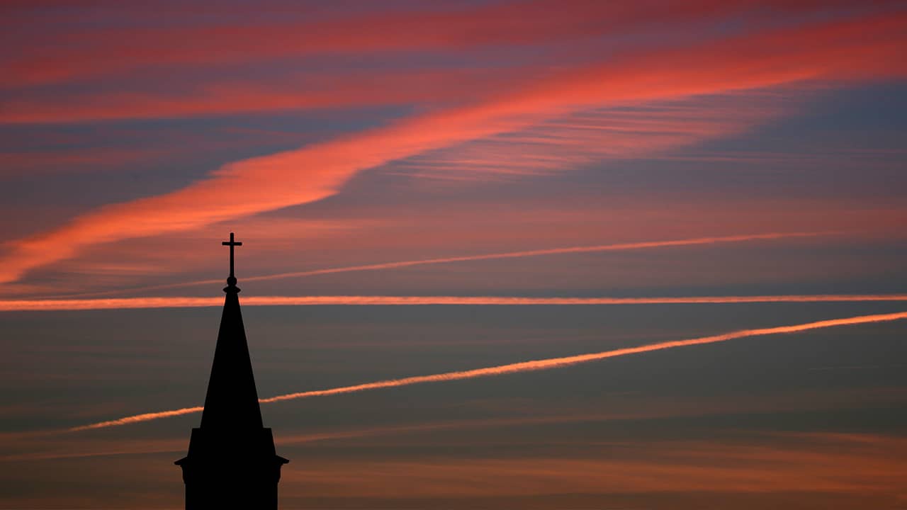 Photo of a church and sunset