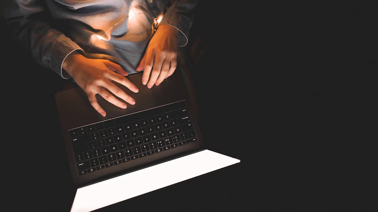 Photo of woman's hands at a laptop