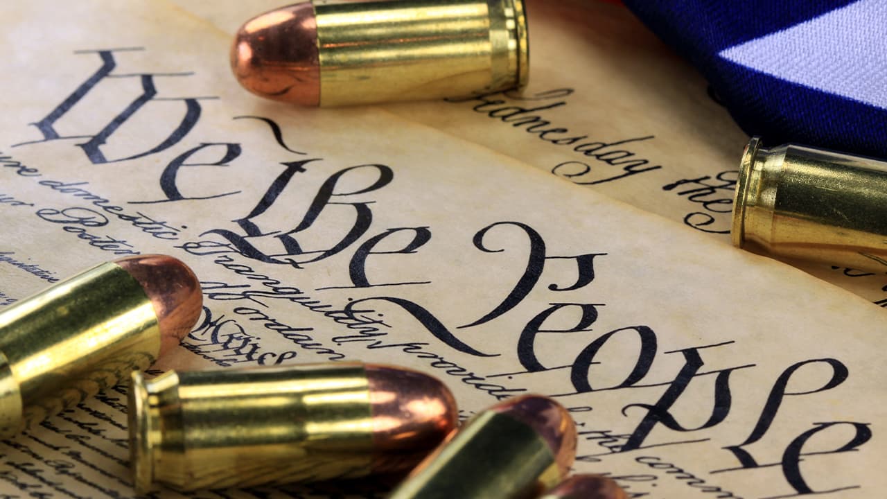 Montage of Constitution and gold bullets signifying the Second Amerndment