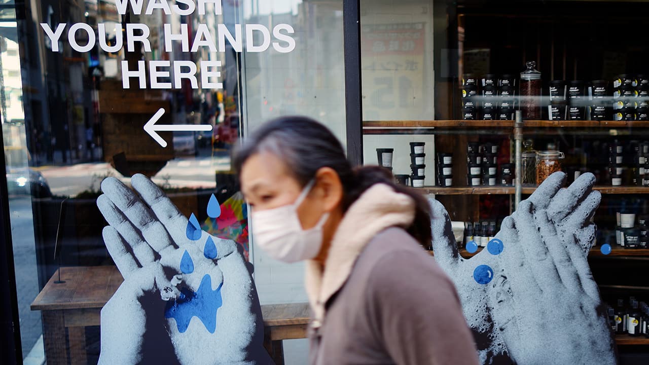 Photo of a woman wearing a face mask in Tokyo
