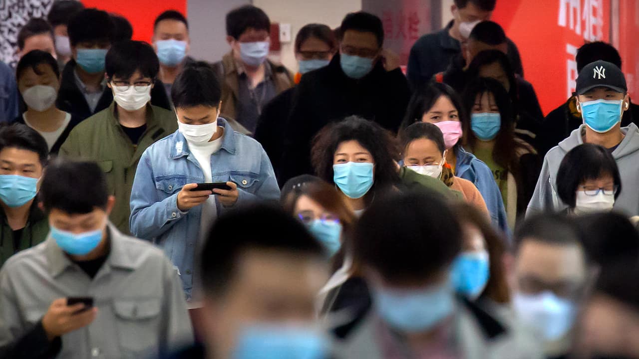 Photo of people wearing face masks in Beijing