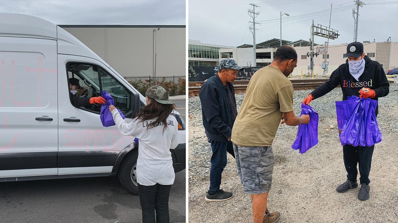 Photo of Elijah Daniel handing out supplies to LA's homeless population