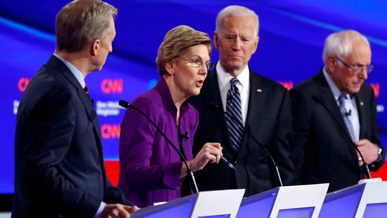 Photo of Democratic presidential candidate Sen. Elizabeth Warren, D-Mass., second from left, speaks as fellow candidates businessman Tom Steyer, left, former Vice President Joe Biden and Sen. Bernie Sanders, I-Vt., right, listen