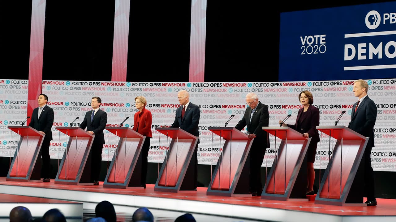 Photo of presidential candidates from left, entrepreneur Andrew Yang, South Bend Mayor Pete Buttigieg, Sen. Elizabeth Warren, D-Mass., former Vice President Joe Biden, Sen. Bernie Sanders, I-Vt., Sen. Amy Klobuchar, D-Minn., and businessman Tom Steyer