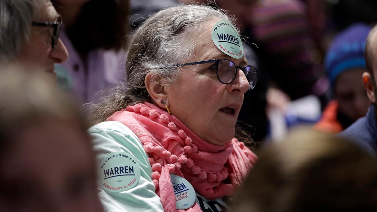 Photo of a woman with a Warren sticker on her forehead
