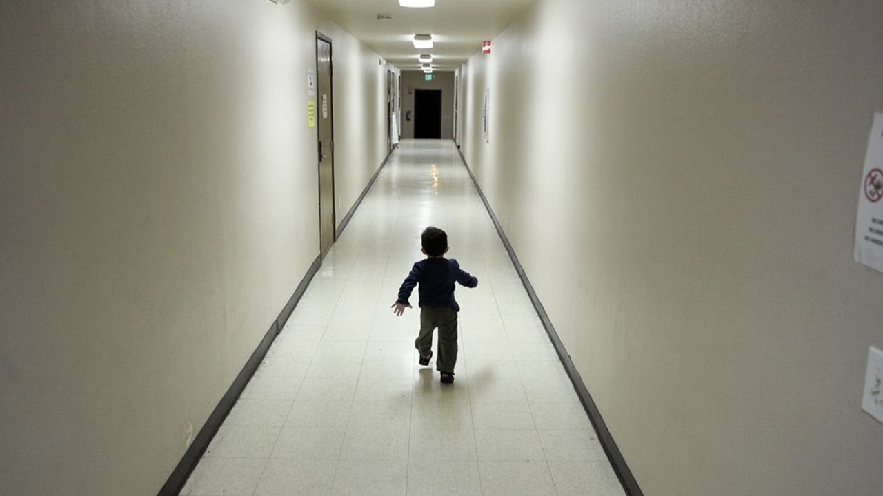 Photo of a child running down a hallway