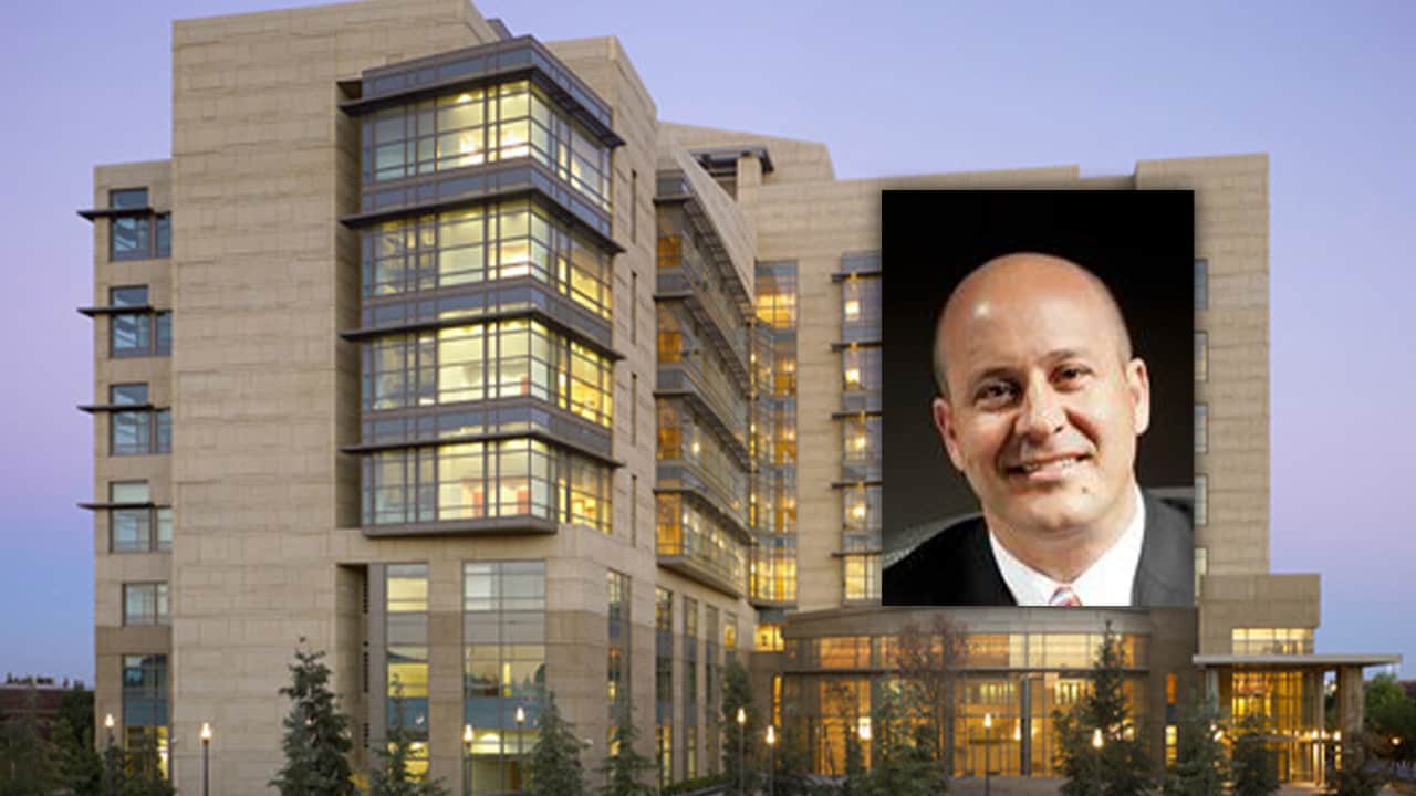 Phot of Dirk Paloutzian embedded into a picture of the downtown Fresno federal courhouse