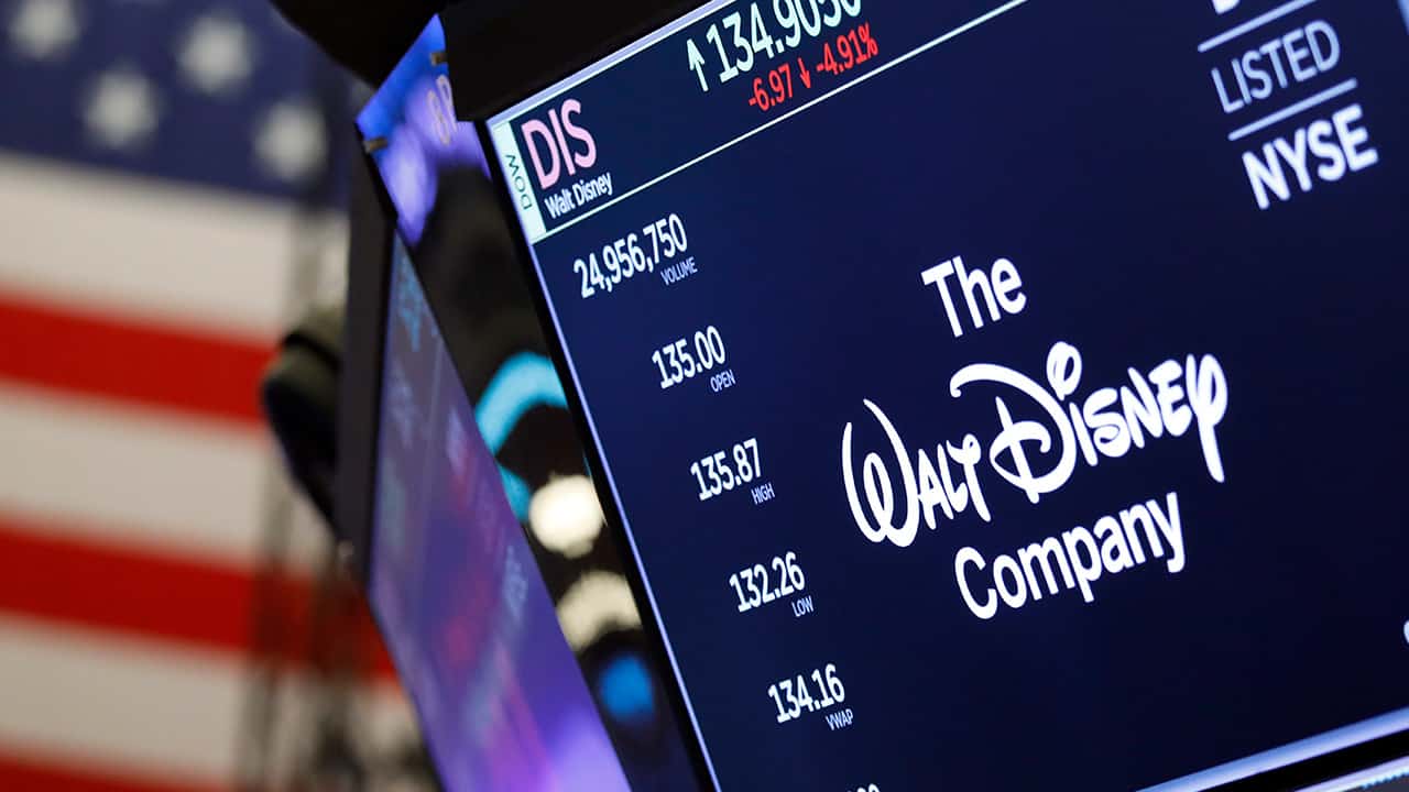 Photo of logo for the Walt Disney Co. above a trading post 