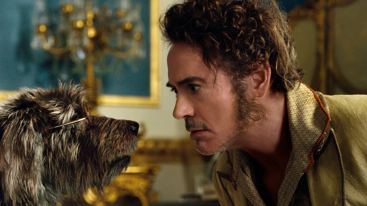 Photo of Dr. John Dolittle, portrayed by Robert Downey Jr., right, with Jip, voiced by Tom Holland, in a scene from "Dolittle." 
