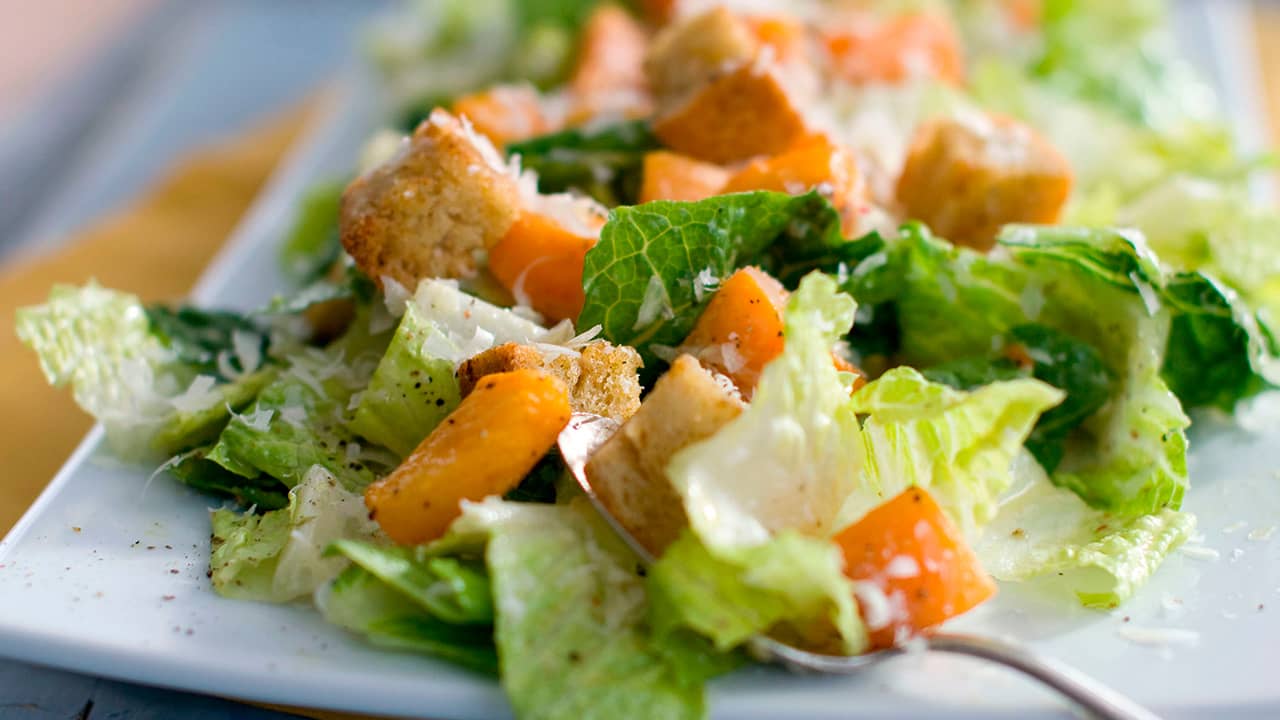 Photo of a caesar salad with romaine lettuce