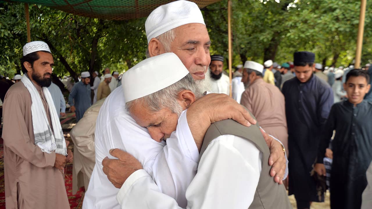 Photo of Pakistani Muslims greeting each other