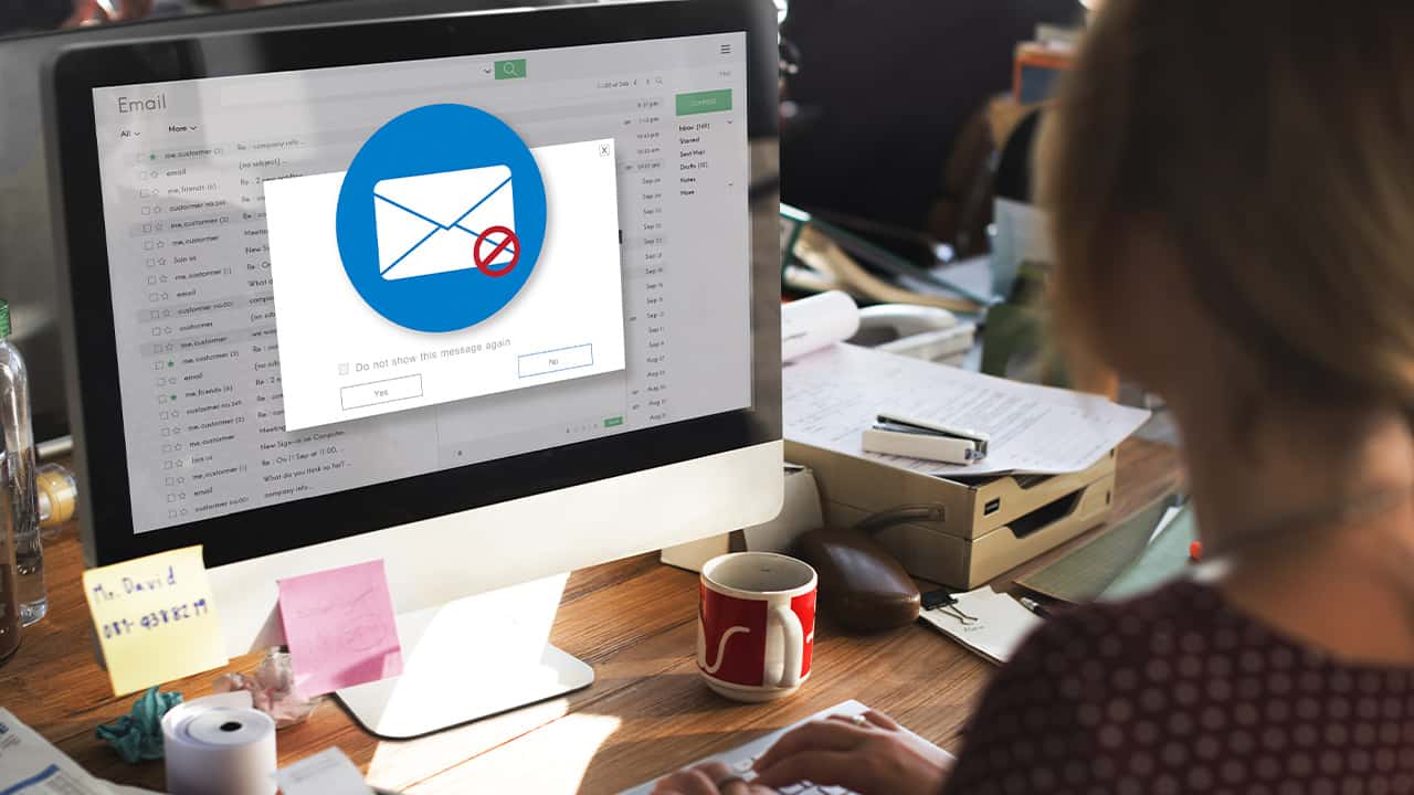 Photo of an e-mail warning pop up on a woman's computer